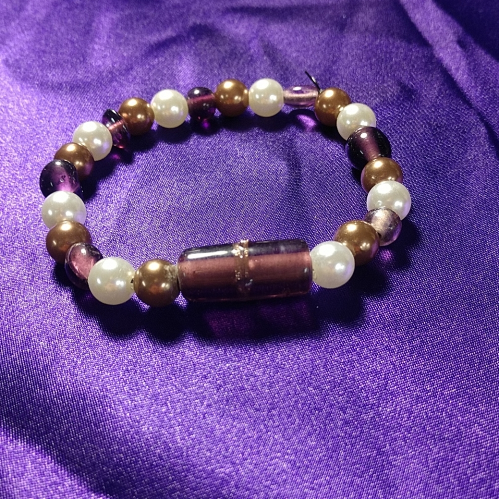 white, purple, and brown bracelet